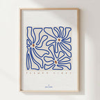 Affiche A4 encadrée : fleurs au trait bleu et texte « FLOWER VIBES »