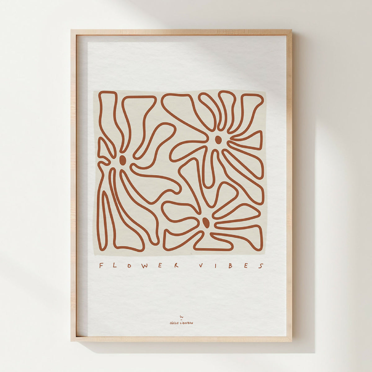 Affiche A4 encadrée, fleurs stylisées au trait terracotta avec texte « FLOWER VIBES »