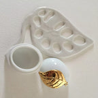 Boîte à bijoux citron avec compartiment rond ouvert et capot doré
