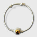 Bracelet cordon blanc avec goutte dorée brillante en porcelaine
