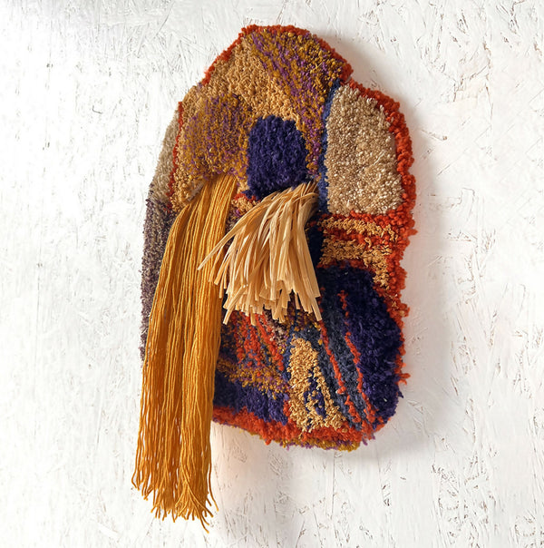 Sac patchwork en tissu multicolore à franges dorées, motifs bleus et bruns