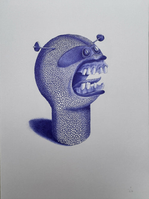 Figurine de créature bleue : tête avec dents, yeux et deux appendices