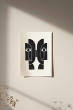 Linogravure encadrée « Sœurs Jumelles » : motifs de visages noir et blanc