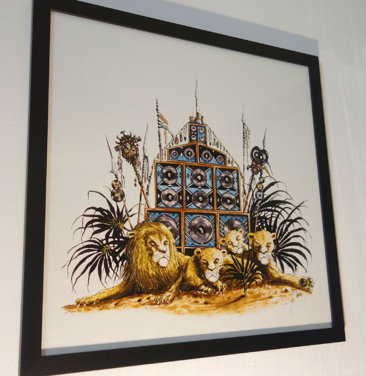 Tableau Lion Arena 50x50 cm encadré : lions dorés et temple bleu avec percussions