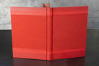 Carnet ou livre d’or rouge monochrome, couverture rigide et tranche centrale visible