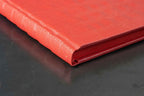 Carnet rouge à reliefs, vue du bord et de la tranche