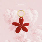 Porte-clés fleur rouge, anneau doré, pétales avec inscription « MA FLEUR »
