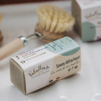 Savon détachant en barre beige dans emballage blanc, pour textiles