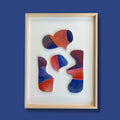 Tableau en relief Kokoro : cadre beige, formes abstraites orange, bleu et violet sur fond clair.