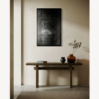 Tableau encadré noir et gris, composition géométrique avec texture en damier.