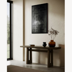 Tableau abstrait noir à formes rectangulaires en relief, bordure noire mate.