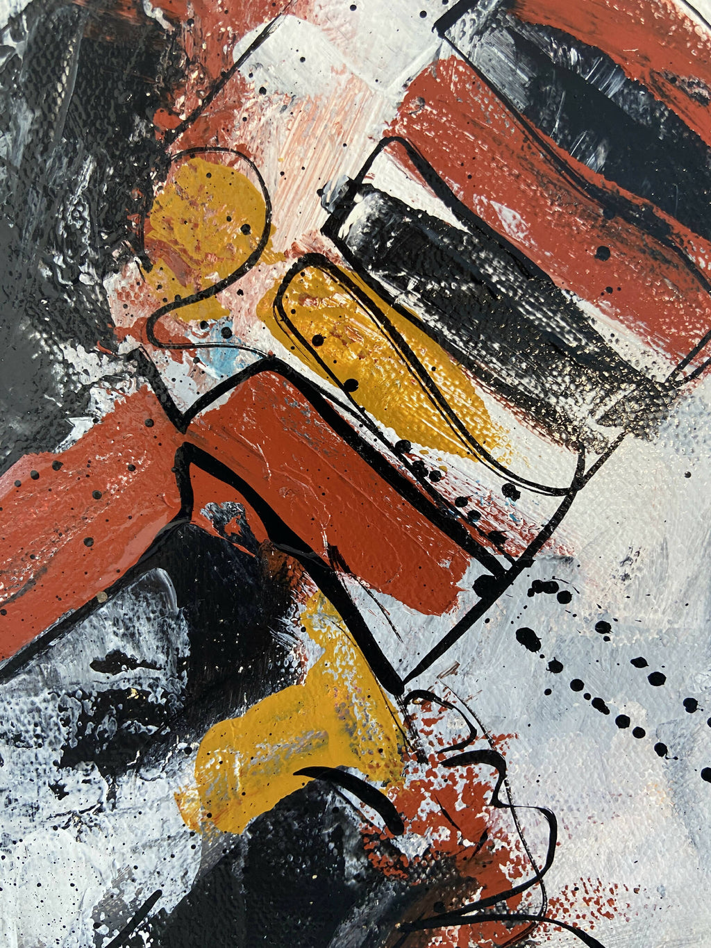 Détails du tableau abstrait : formes rouges, jaunes et noires, lignes et éclaboussures.